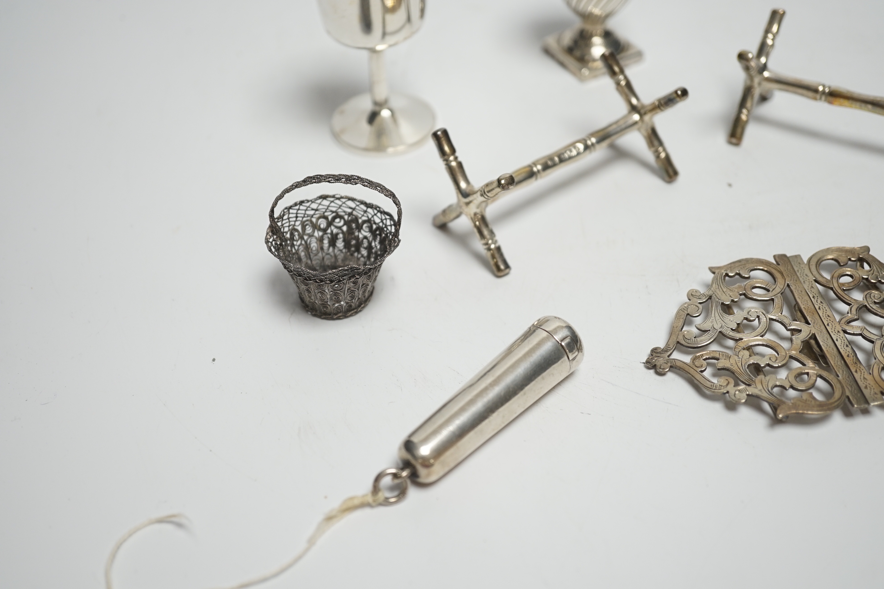 A pair of late Victorian silver knife rests and sundry small silver including belt buckle, pepperette etc